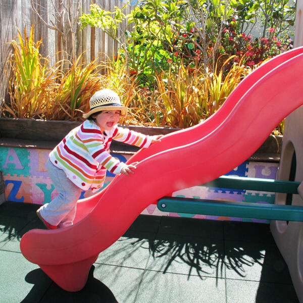 Untitled Child climbing on the outdoor slide