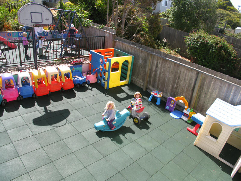 Untitled Child playing on outdoor playground equipment
