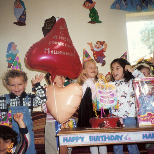 Untitled Children gathered for a birthday celebration