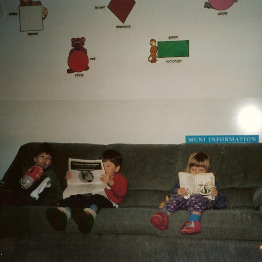 Untitled Children reading books on the couch