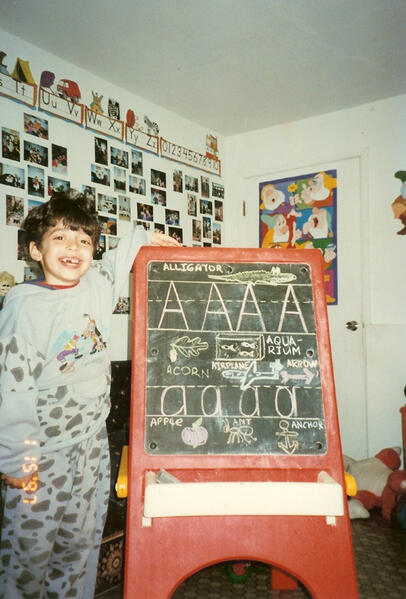 Untitled Infants playing with an alphabet activity toy