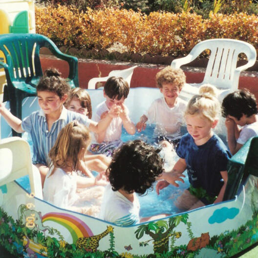 Untitled Children enjoying water play in the backyard at Lana's Sunset Preschool