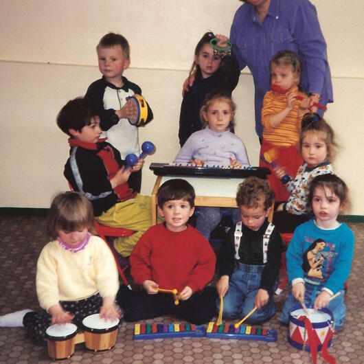 Untitled Children playing rhythm instruments together
