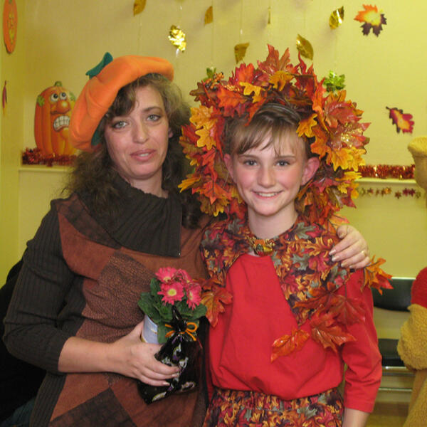 Untitled Lana and child in fall performance costumes