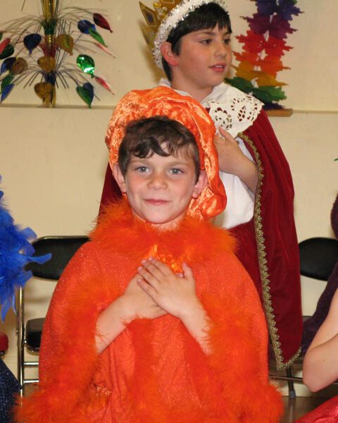 Untitled Child in costume with Santa during a holiday celebration